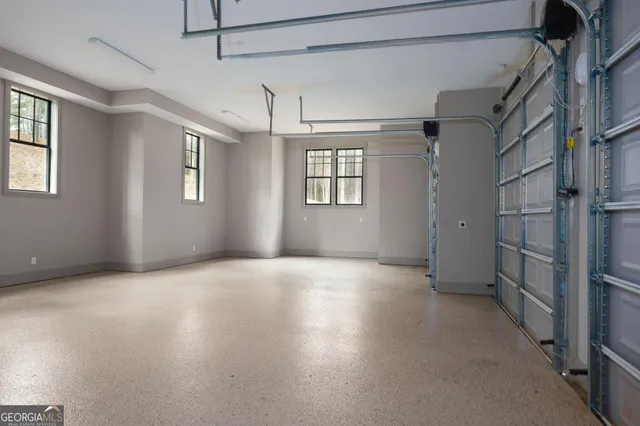 a view of an empty room with a mirror