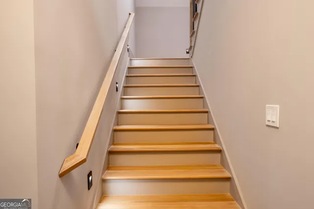 a bathroom with a bathtub shower sink vanity mirror and toilet