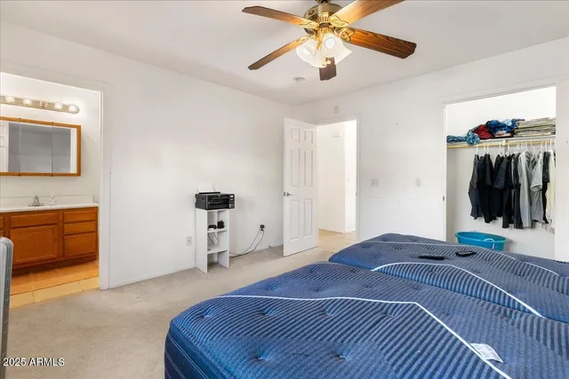 a bedroom with a bed and a walk in closet