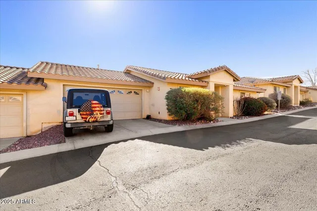 a view of a car park in front of a house