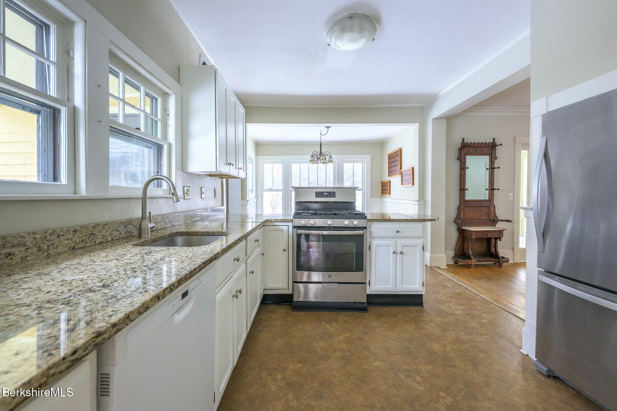 5 Stockbridge Road West Stockbridge, MA 01266 - Photo 23 of 60 a kitchen with granite countertop a sink stainless steel appliances and cabinets