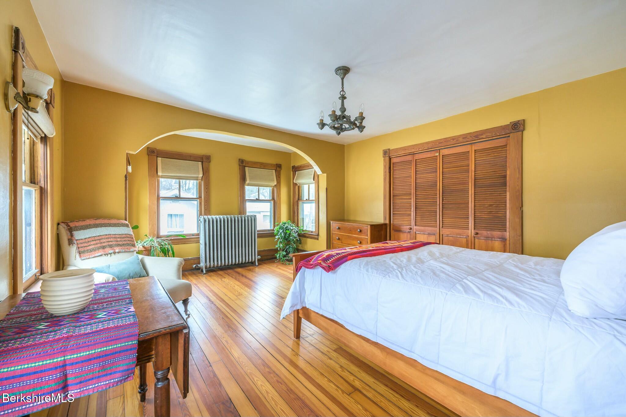 5 Stockbridge Road West Stockbridge, MA 01266 - Photo 29 of 60 a bedroom with a bed and wooden floors