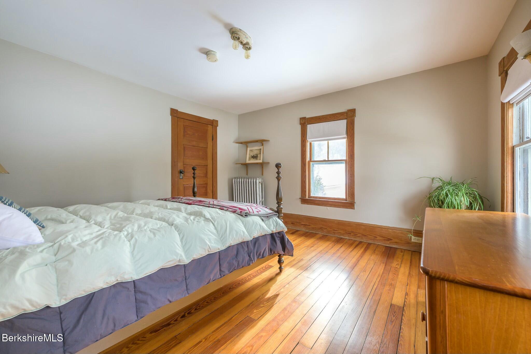 5 Stockbridge Road West Stockbridge, MA 01266 - Photo 31 of 60 a bedroom with a bed and wooden floor