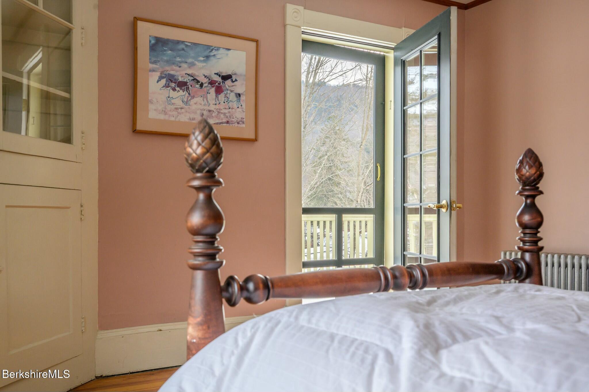 5 Stockbridge Road West Stockbridge, MA 01266 - Photo 35 of 60 a bedroom with a bed and a painting on the wall