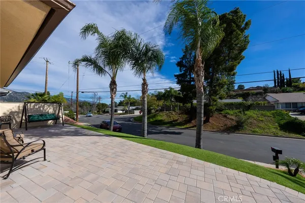 a view of a yard with a patio