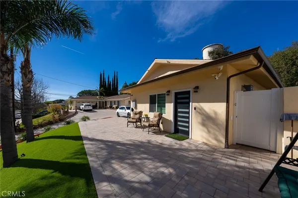 a view of a backyard with a patio