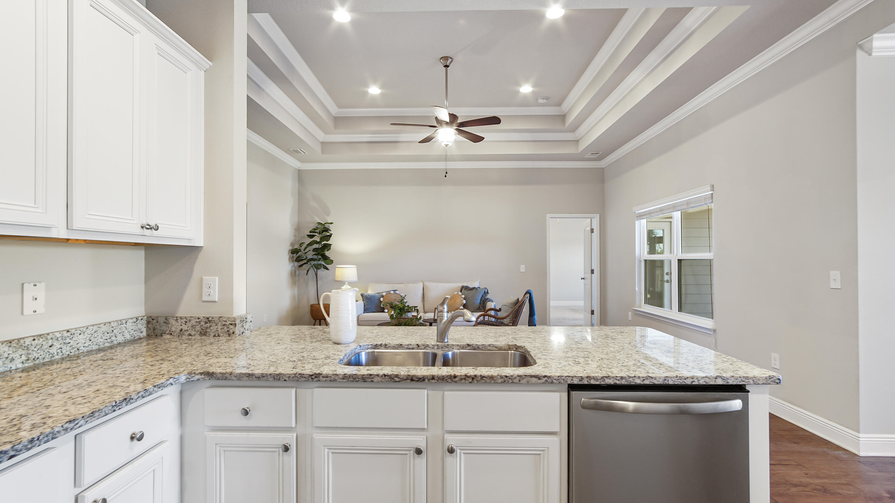96 Mary Ellen Way Freeport, FL 32439 - Photo 17 of 69 a kitchen with granite countertop stainless steel appliances sink and cabinets