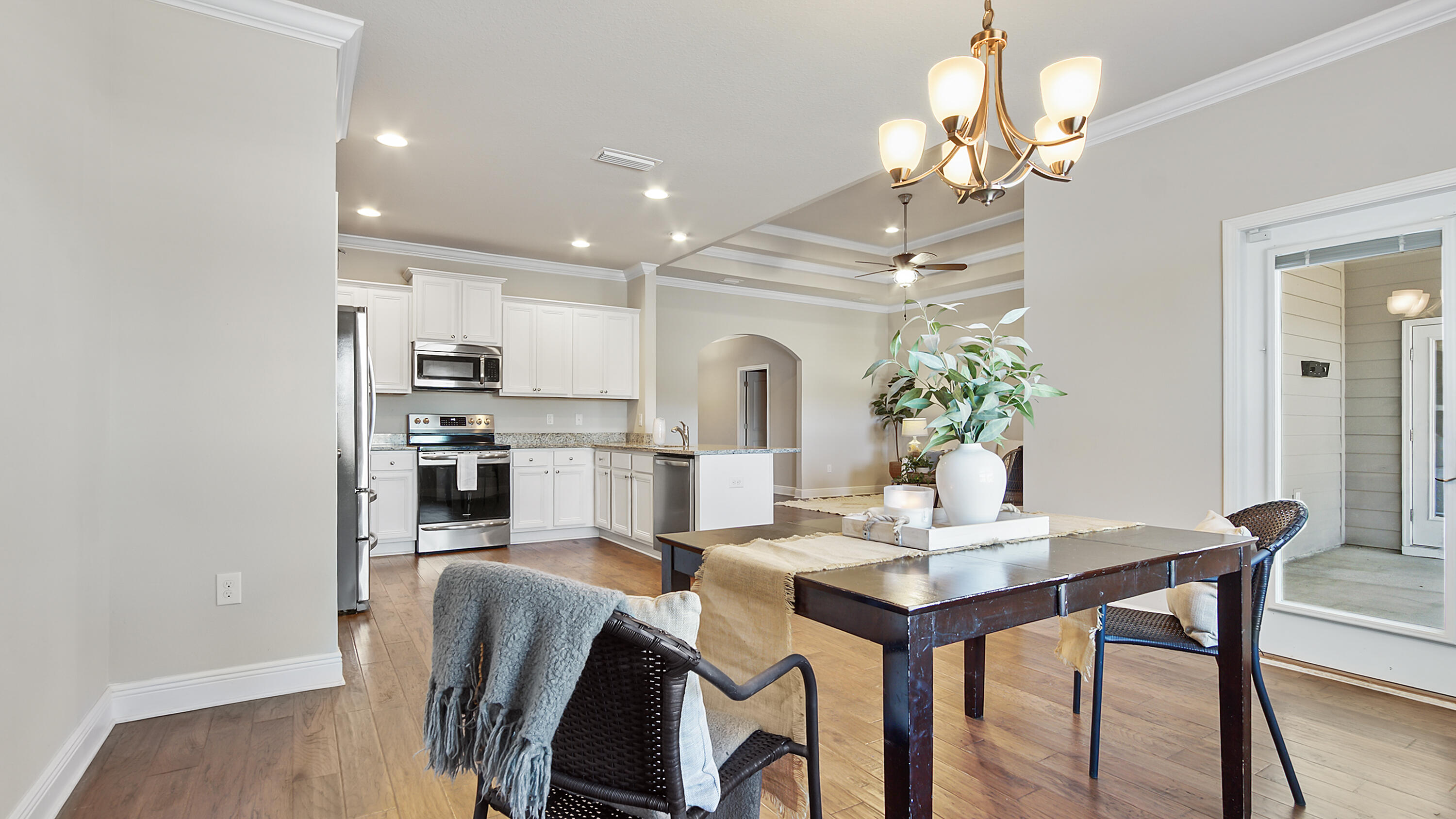 96 Mary Ellen Way Freeport, FL 32439 - Photo 19 of 69 a view of a dining room with furniture and wooden floor