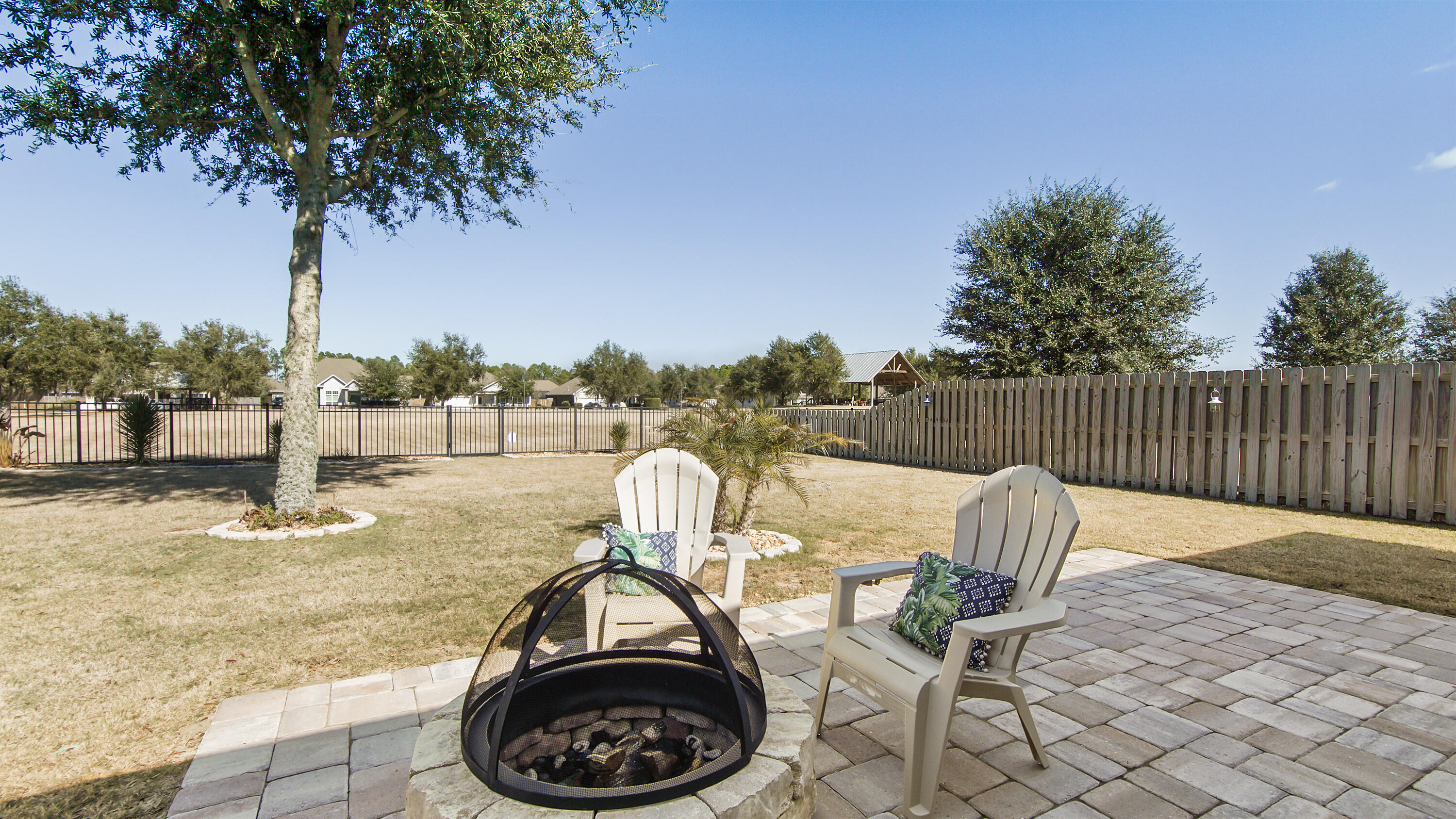 96 Mary Ellen Way Freeport, FL 32439 - Photo 23 of 69 a view of a swimming pool with a patio and fire pit