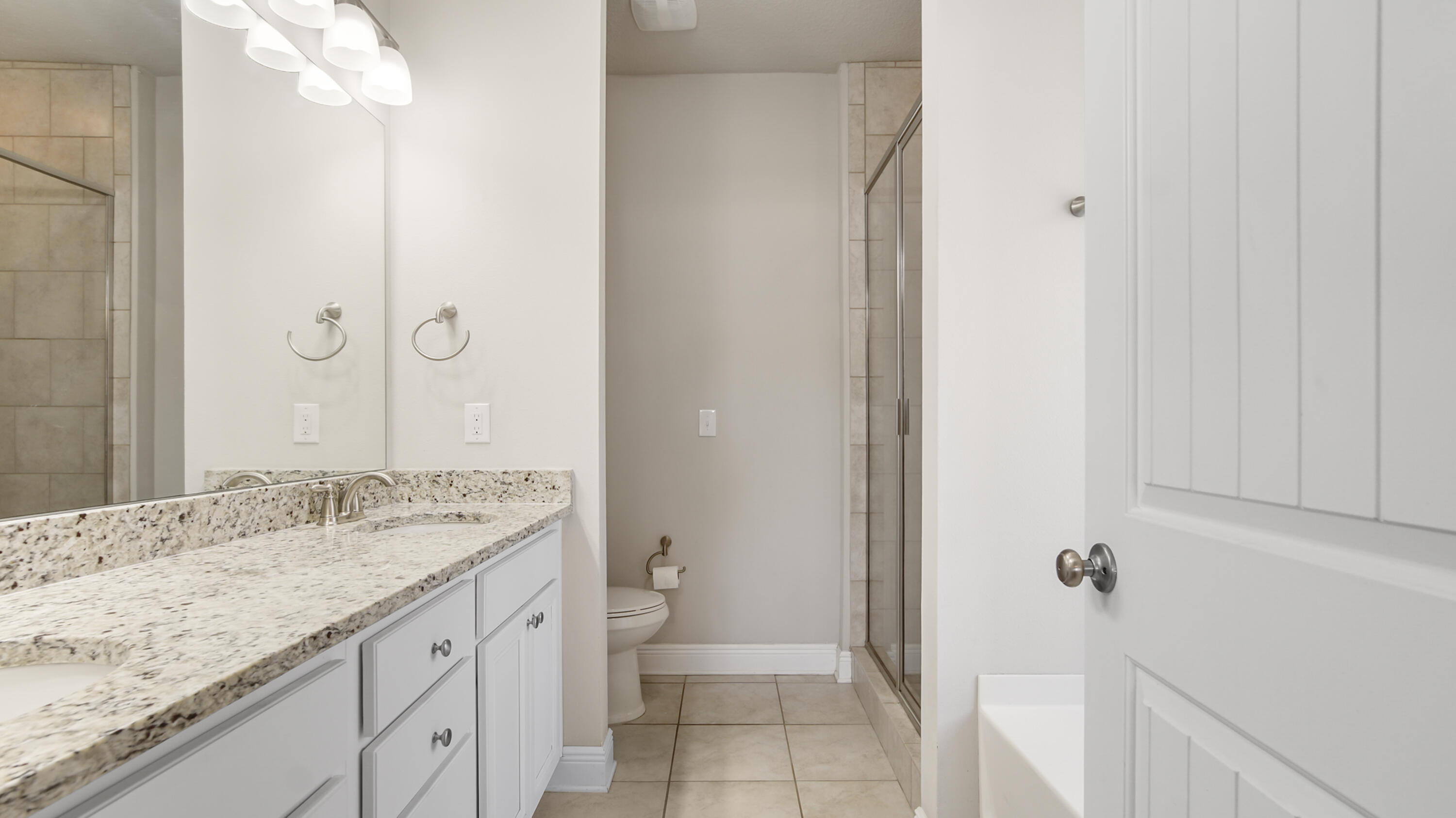 96 Mary Ellen Way Freeport, FL 32439 - Photo 30 of 69 a bathroom with a granite countertop sink toilet and shower