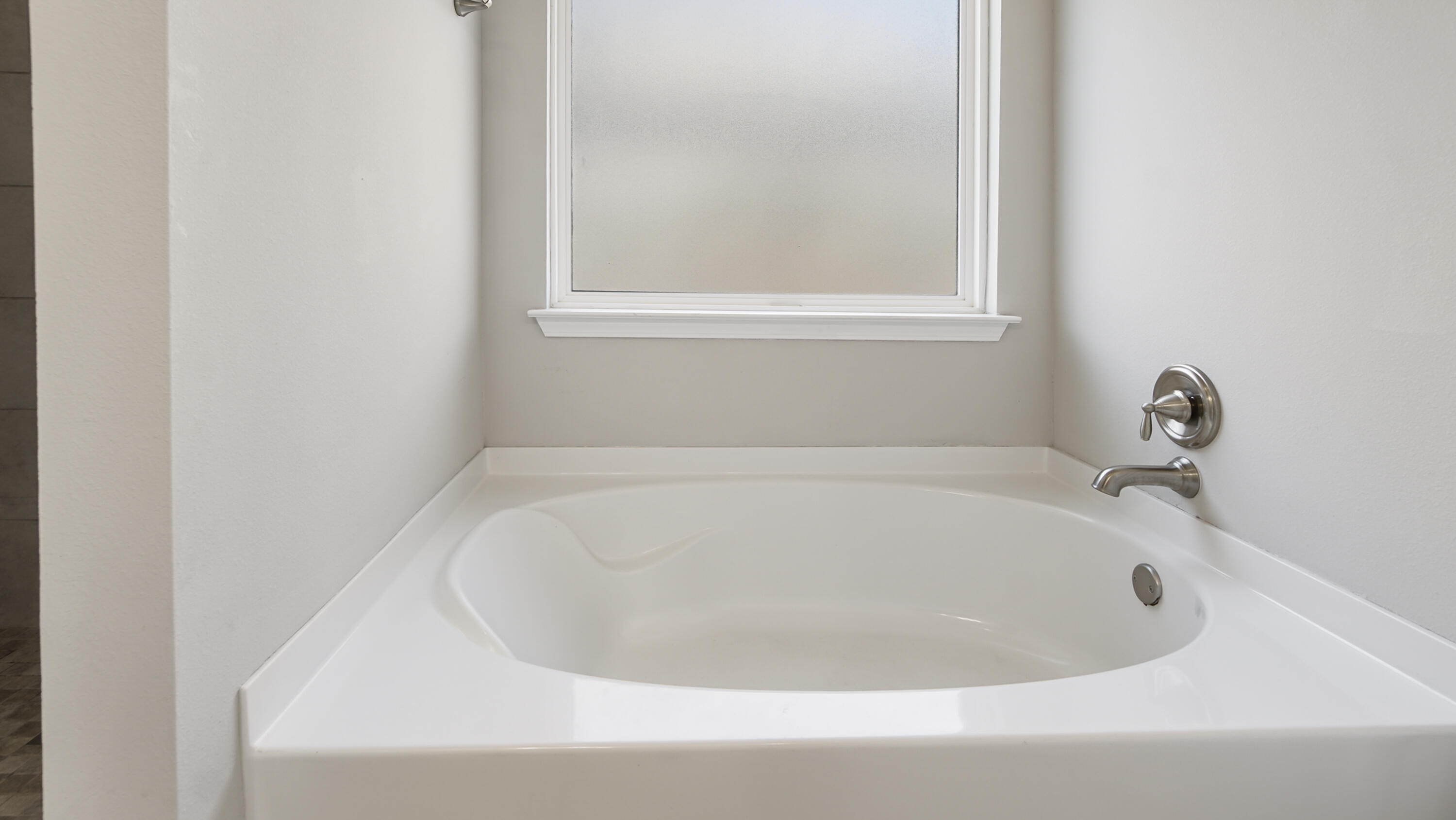 96 Mary Ellen Way Freeport, FL 32439 - Photo 31 of 69 a white bath tub sitting next to a window