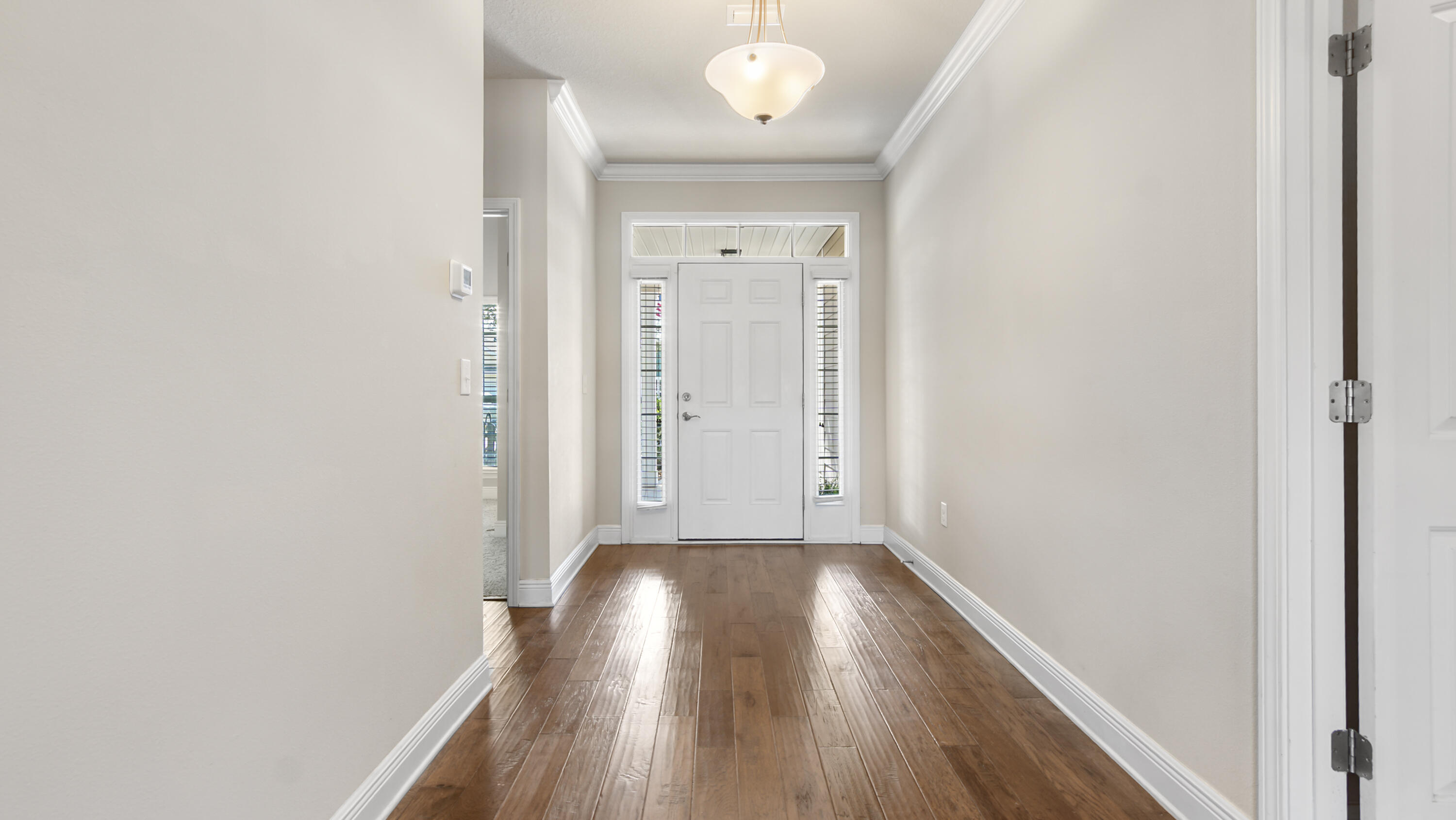 96 Mary Ellen Way Freeport, FL 32439 - Photo 36 of 69 a view of a hallway with wooden floor