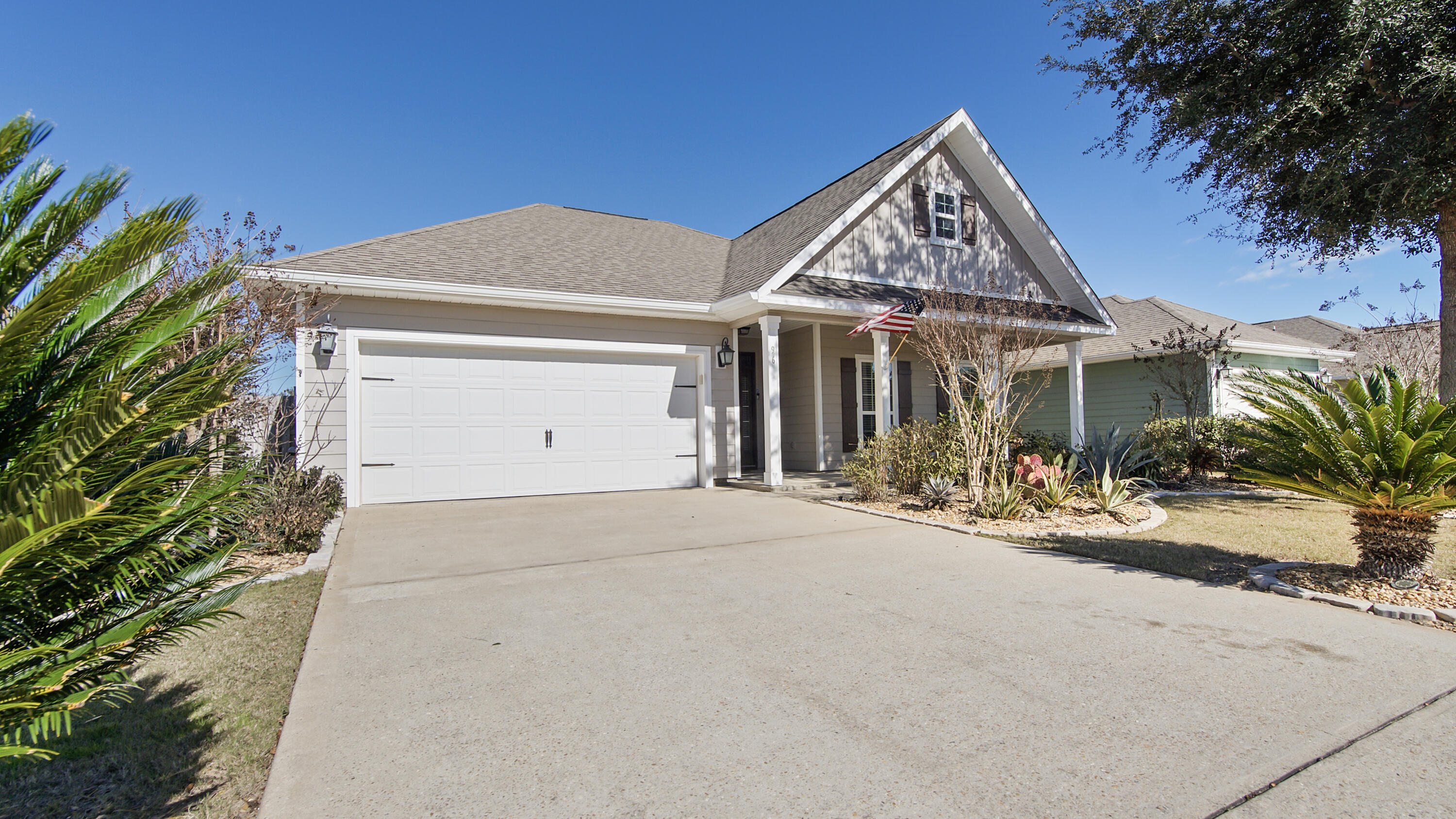 96 Mary Ellen Way Freeport, FL 32439 - Photo 50 of 69 a view of a house with a yard and palm trees