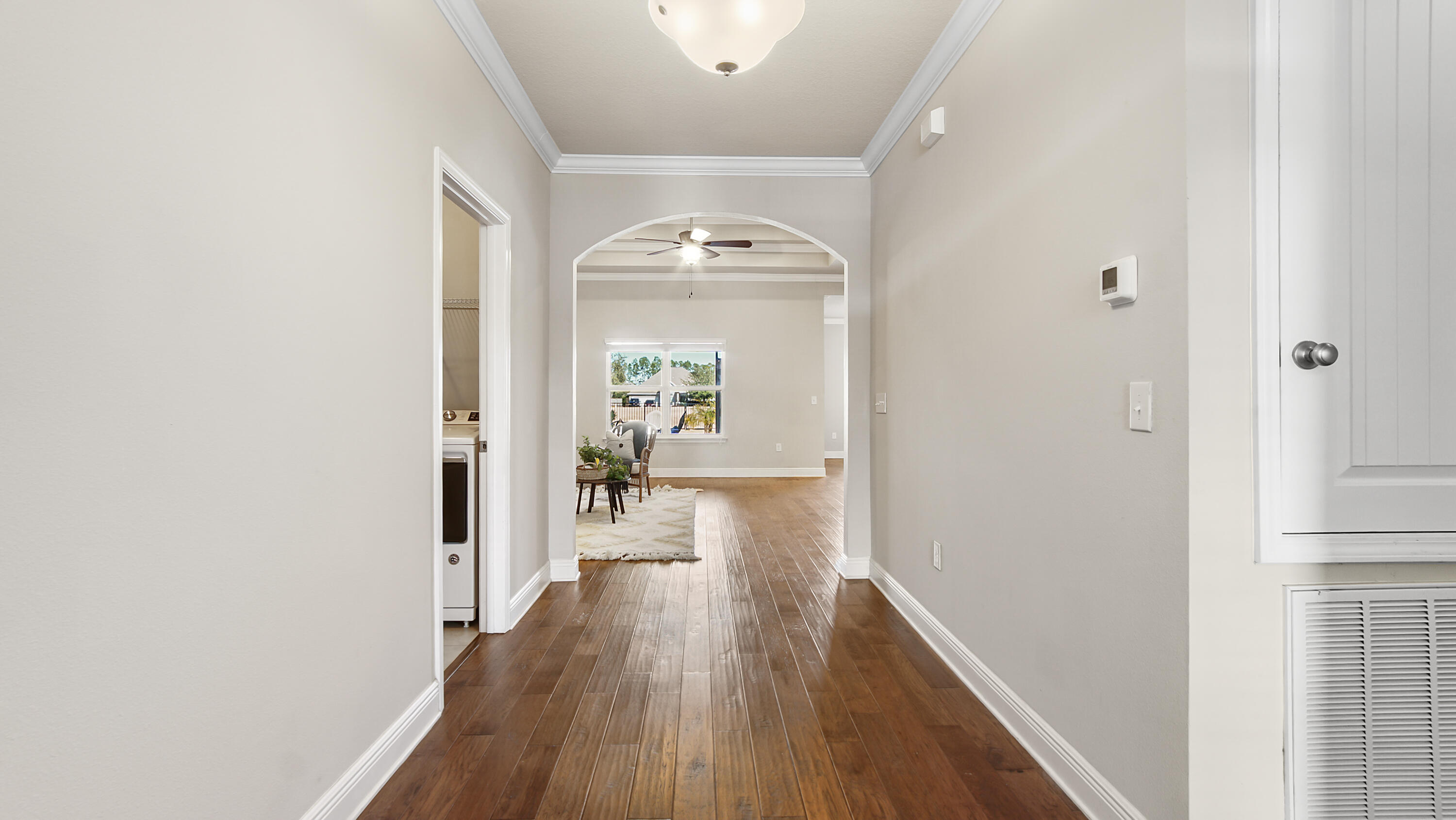 96 Mary Ellen Way Freeport, FL 32439 - Photo 6 of 69 a view of a hallway with wooden floor and a living room