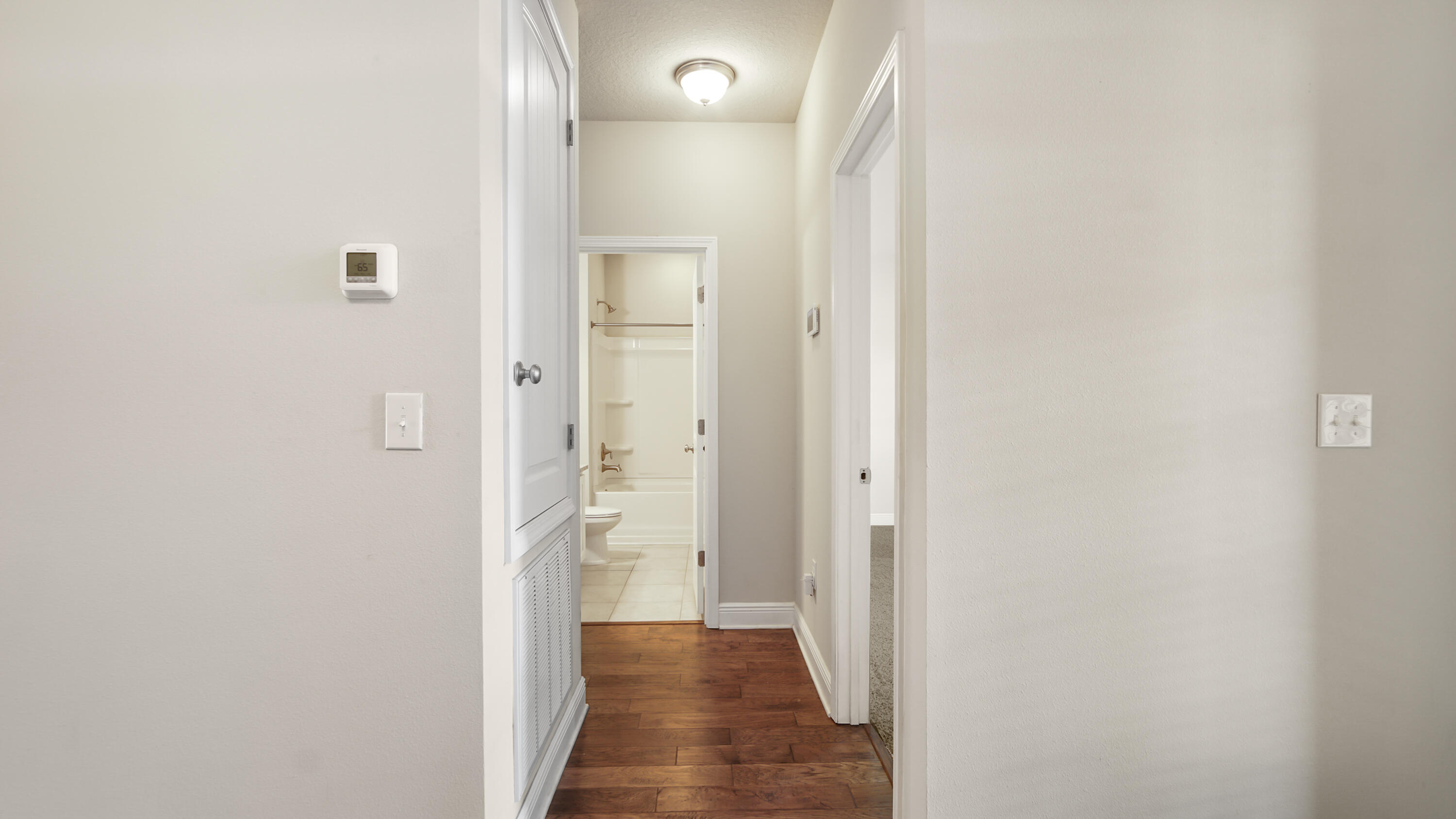 96 Mary Ellen Way Freeport, FL 32439 - Photo 7 of 69 a view of a hallway with wooden floor