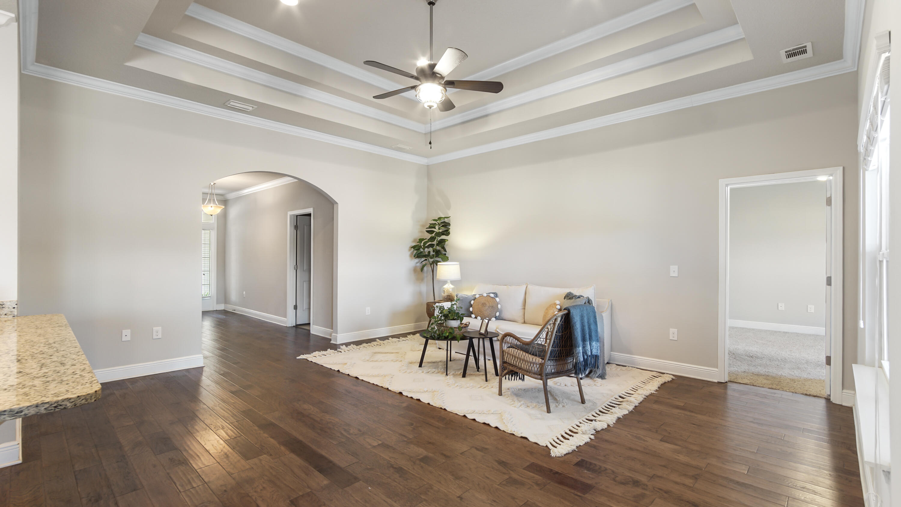 96 Mary Ellen Way Freeport, FL 32439 - Photo 10 of 69 a dining room with wooden floor a chandelier a glass table and chairs