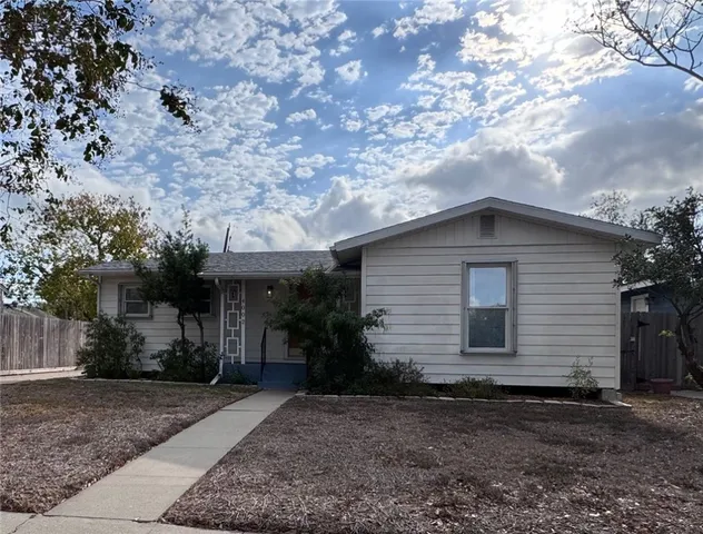 a house with a tree in the background
