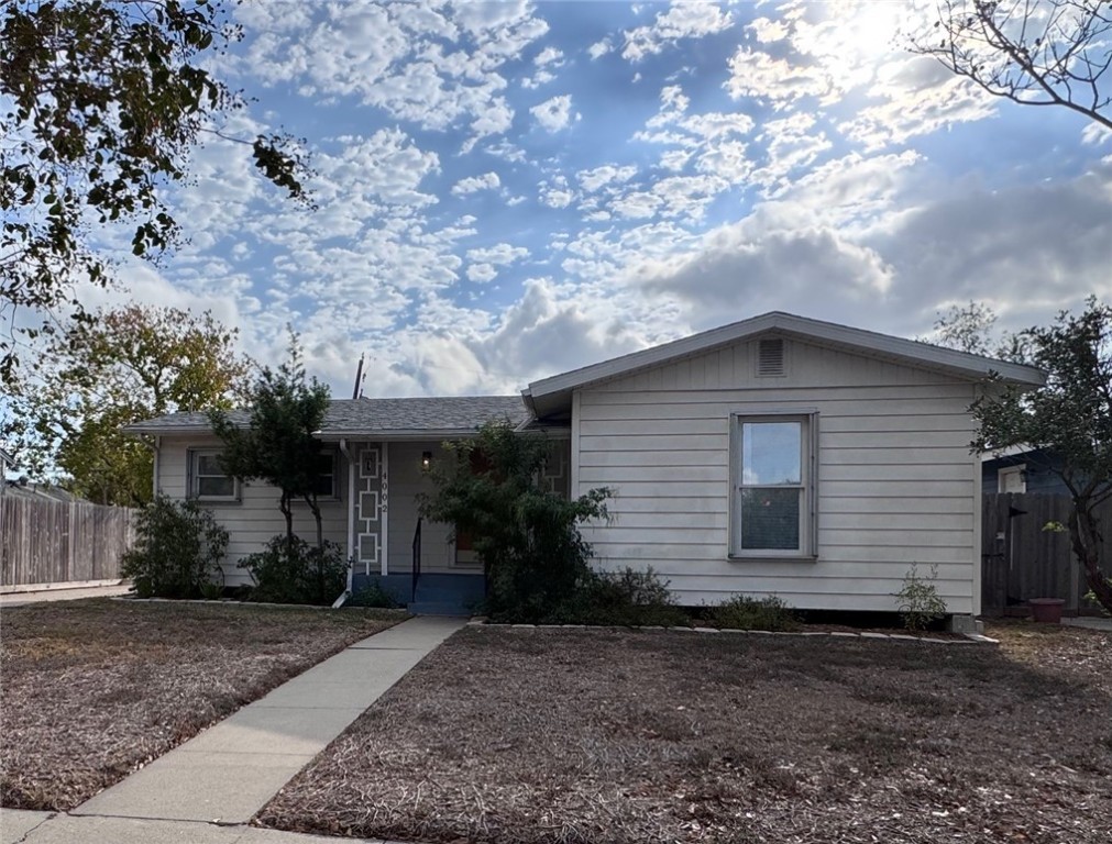 4002 Lowman Street Corpus Christi, TX 78411 - Photo 1 of 18 a house with a tree in the background
