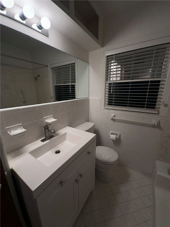 4002 Lowman Street Corpus Christi, TX 78411 - Photo 12 of 18 a bathroom with a sink toilet and shower