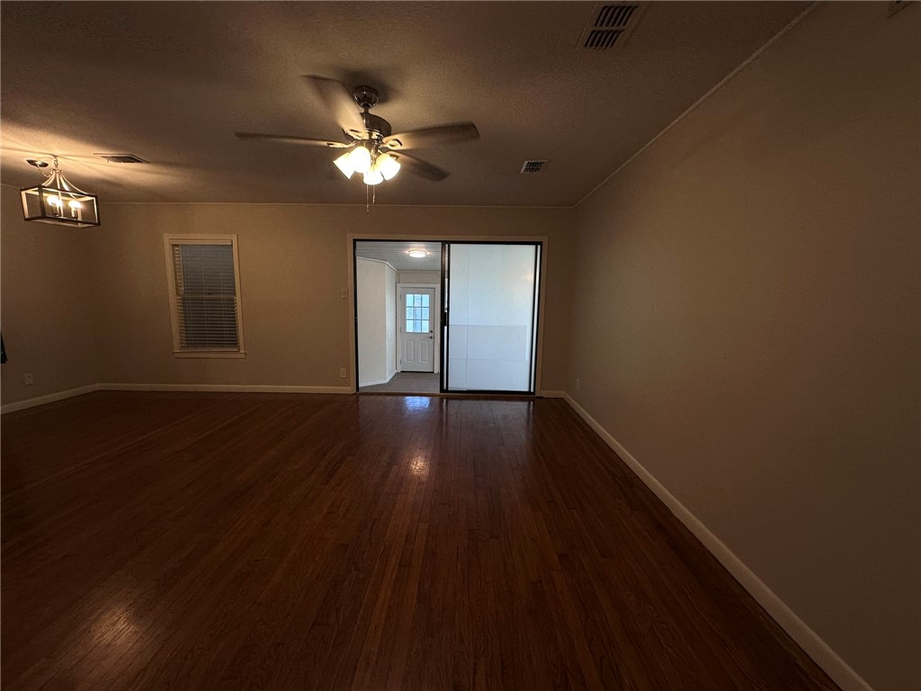 4002 Lowman Street Corpus Christi, TX 78411 - Photo 14 of 18 a view of a livingroom with hardwood floor and a ceiling fan