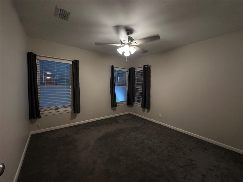 4002 Lowman Street Corpus Christi, TX 78411 - Photo 7 of 18 a view of a livingroom with a ceiling fan and window
