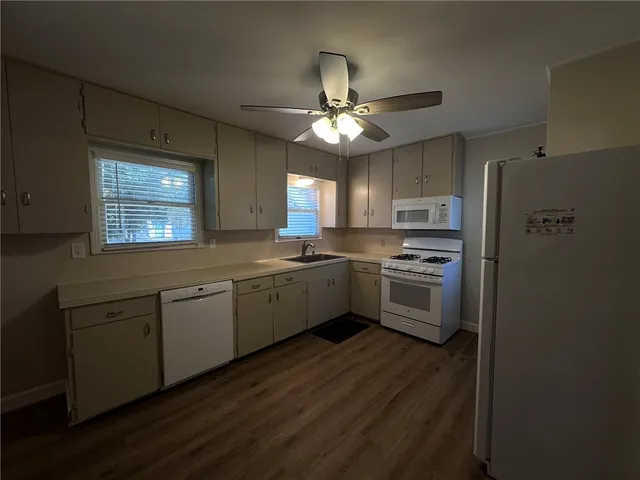 a kitchen with a refrigerator a sink and dishwasher