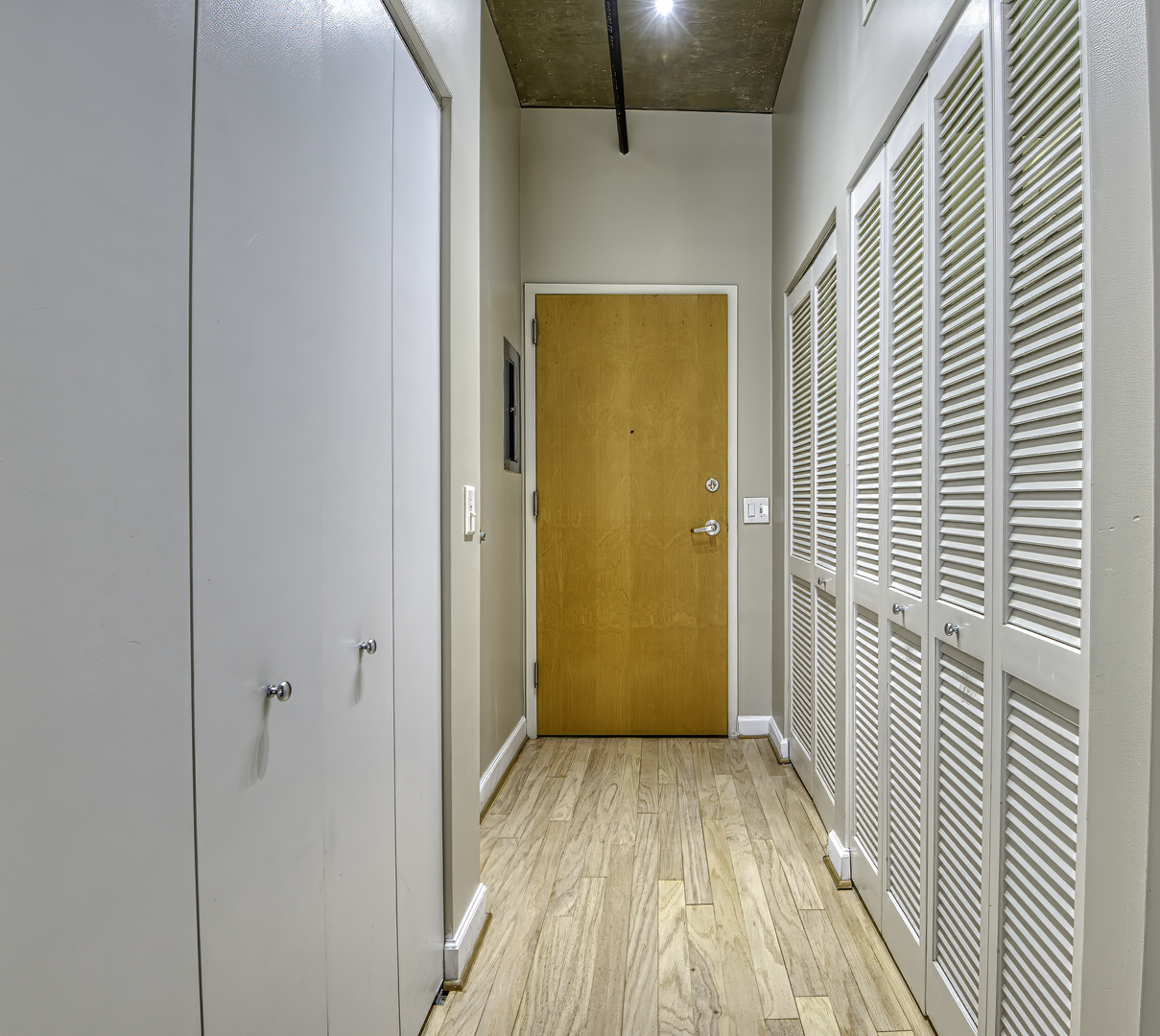 111 South Morgan Street, Unit 518 Chicago, IL 60607 - Photo 17 of 18 a view of a hallway with wooden floor