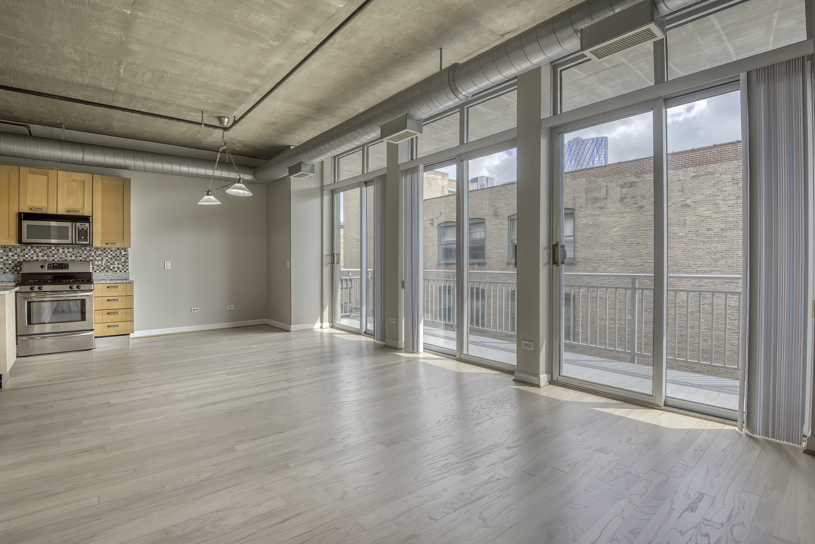 111 South Morgan Street, Unit 518 Chicago, IL 60607 - Photo 5 of 18 a view of an empty room with a window