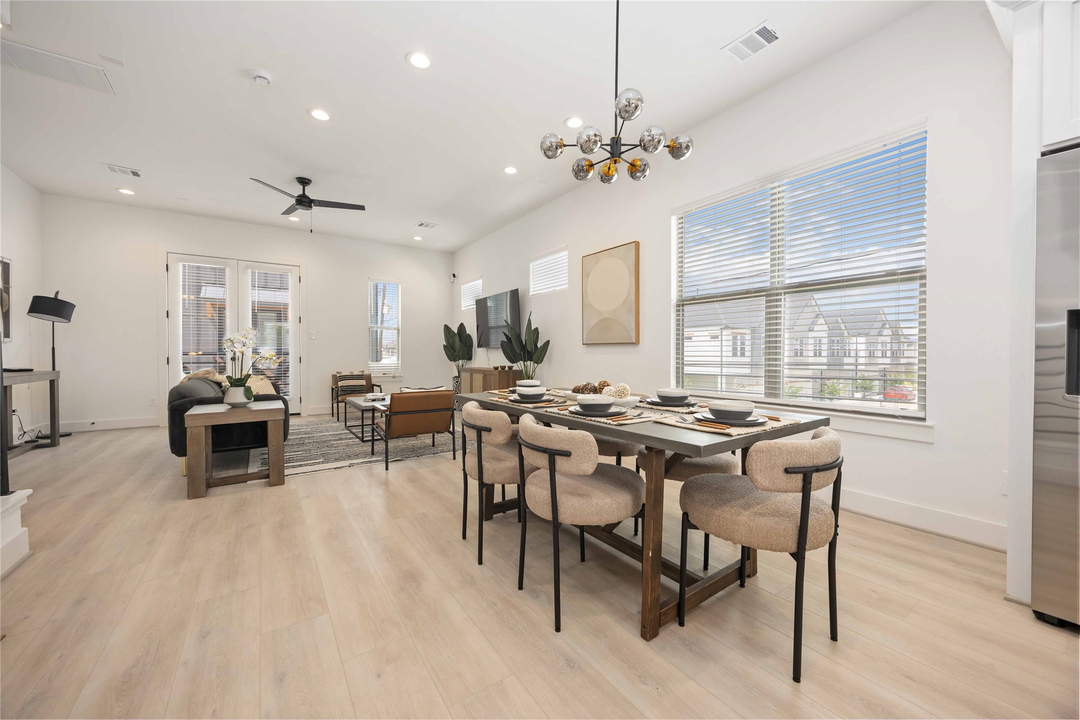 7809 Amelia Road, Unit B Houston, TX 77055 - Photo 10 of 34 Open concept living/dining/kitchen. Photo of the model home. Finishes & specifications may vary.