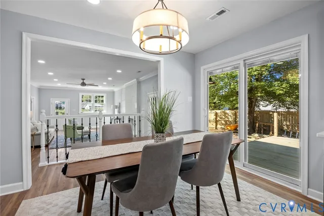 a kitchen with granite countertop stainless steel appliances cabinets a sink and a window