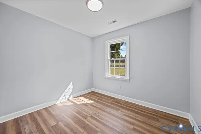 a bathroom with a sink a toilet and a window