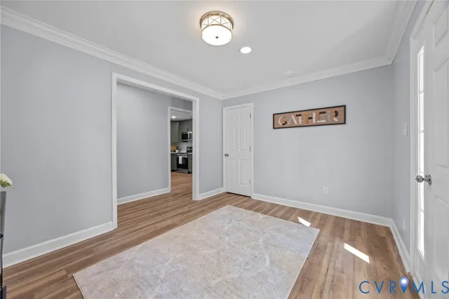 a view of an entryway with wooden floor