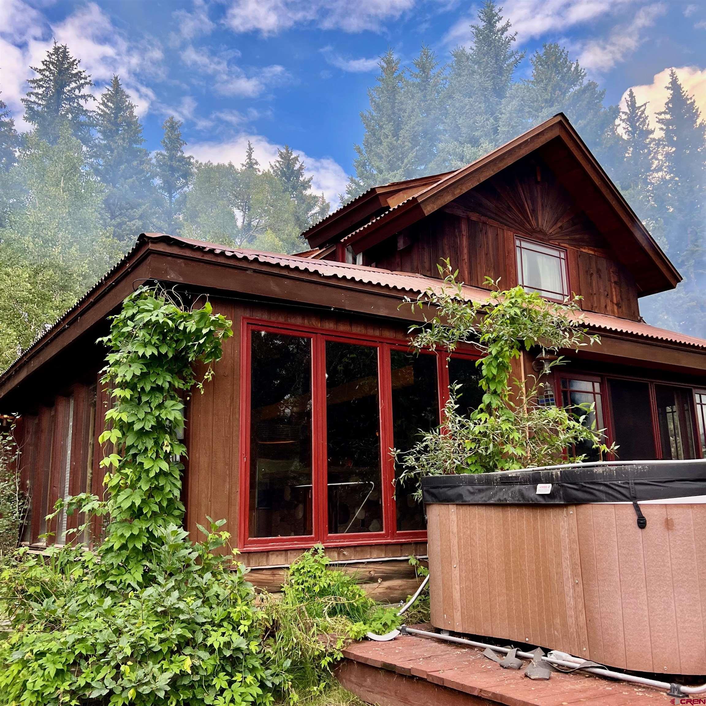 202 Lower Allen Road Crested Butte, CO 81224 - Photo 6 of 21 front view of a house with potted plants