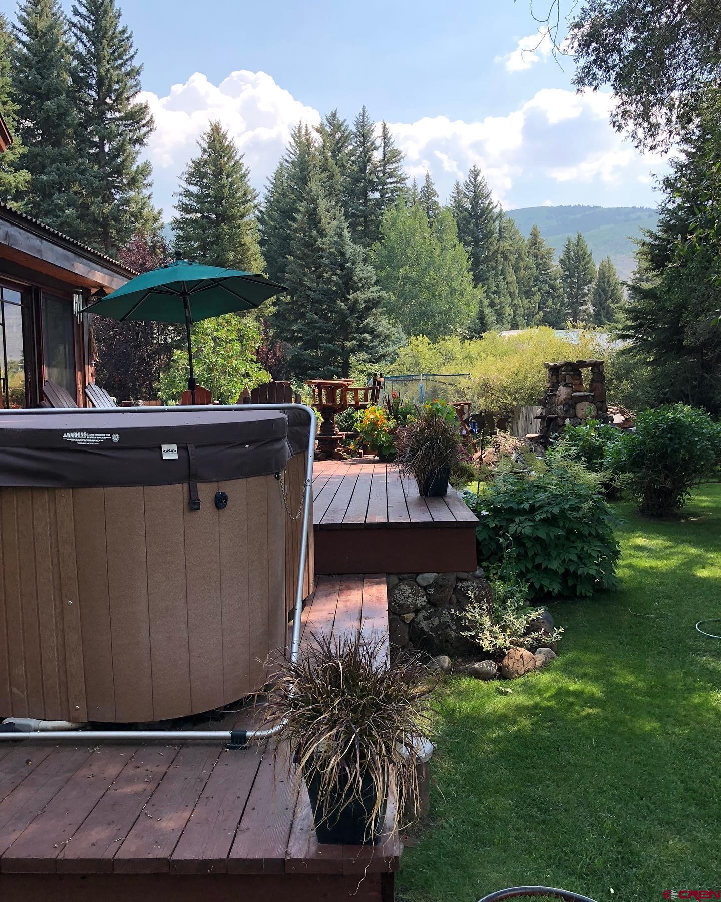 202 Lower Allen Road Crested Butte, CO 81224 - Photo 7 of 21 a view of house with backyard and outdoor seating