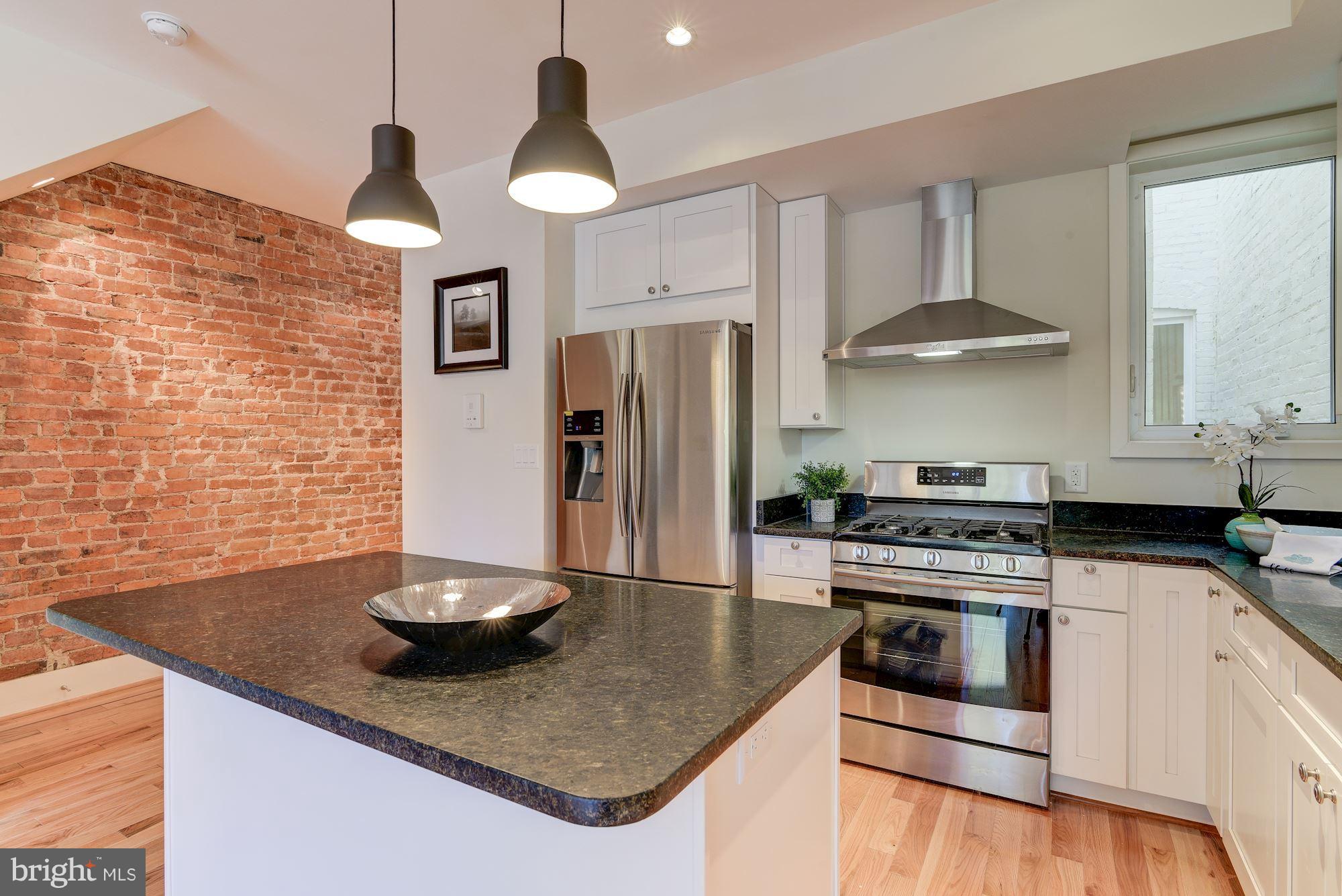 2703 11th Street Northwest, Unit 2 Washington, DC 20001 - Photo 11 of 28 Center island has space for bar stools
