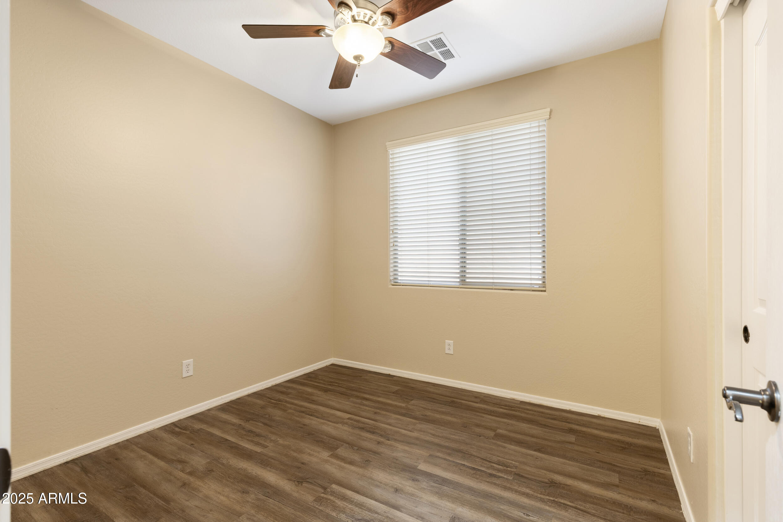 1870 South Colt Drive Gilbert, AZ 85295 - Photo 21 of 42 wooden floor in an empty room with a window