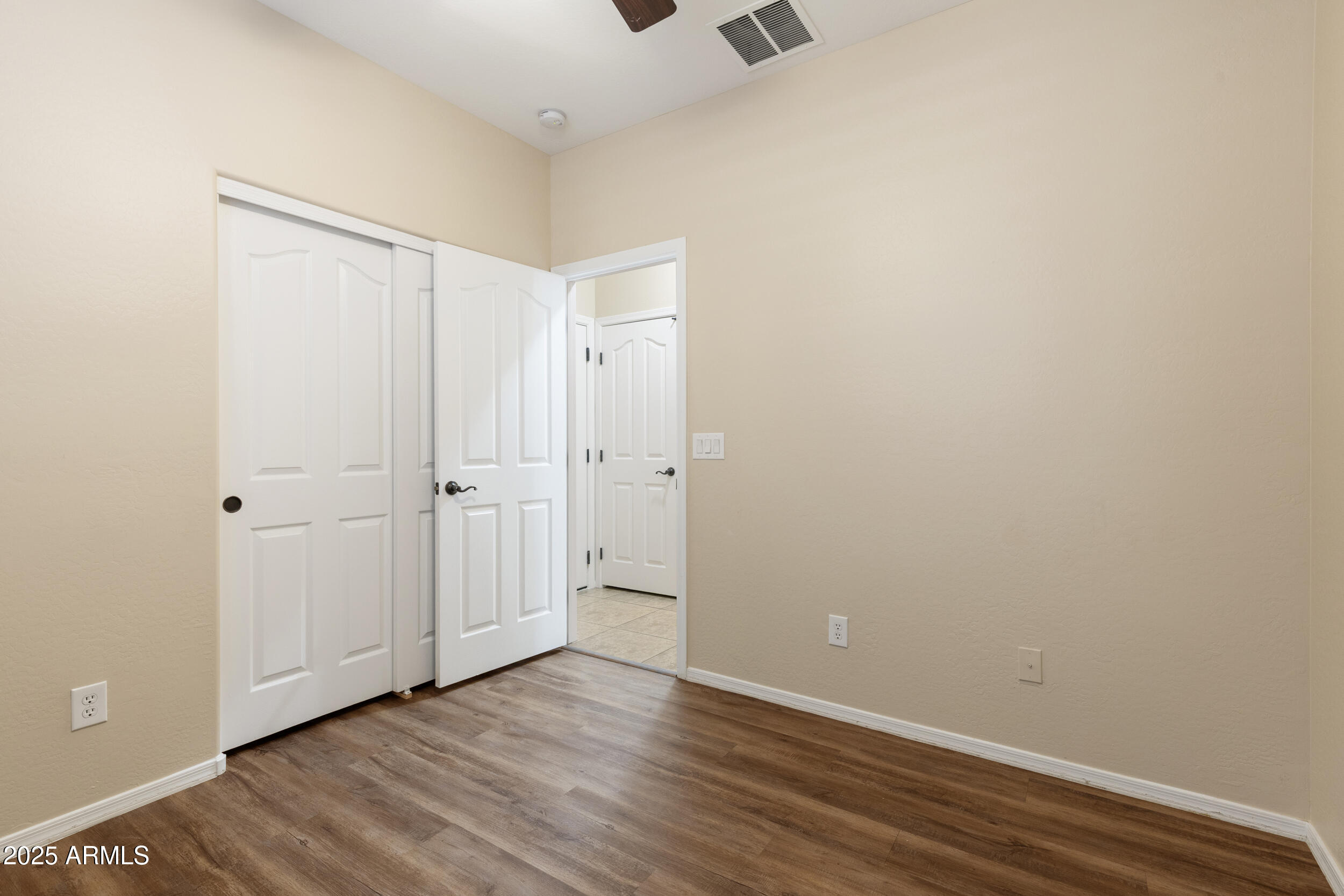 1870 South Colt Drive Gilbert, AZ 85295 - Photo 22 of 42 a view of an empty room with wooden floor