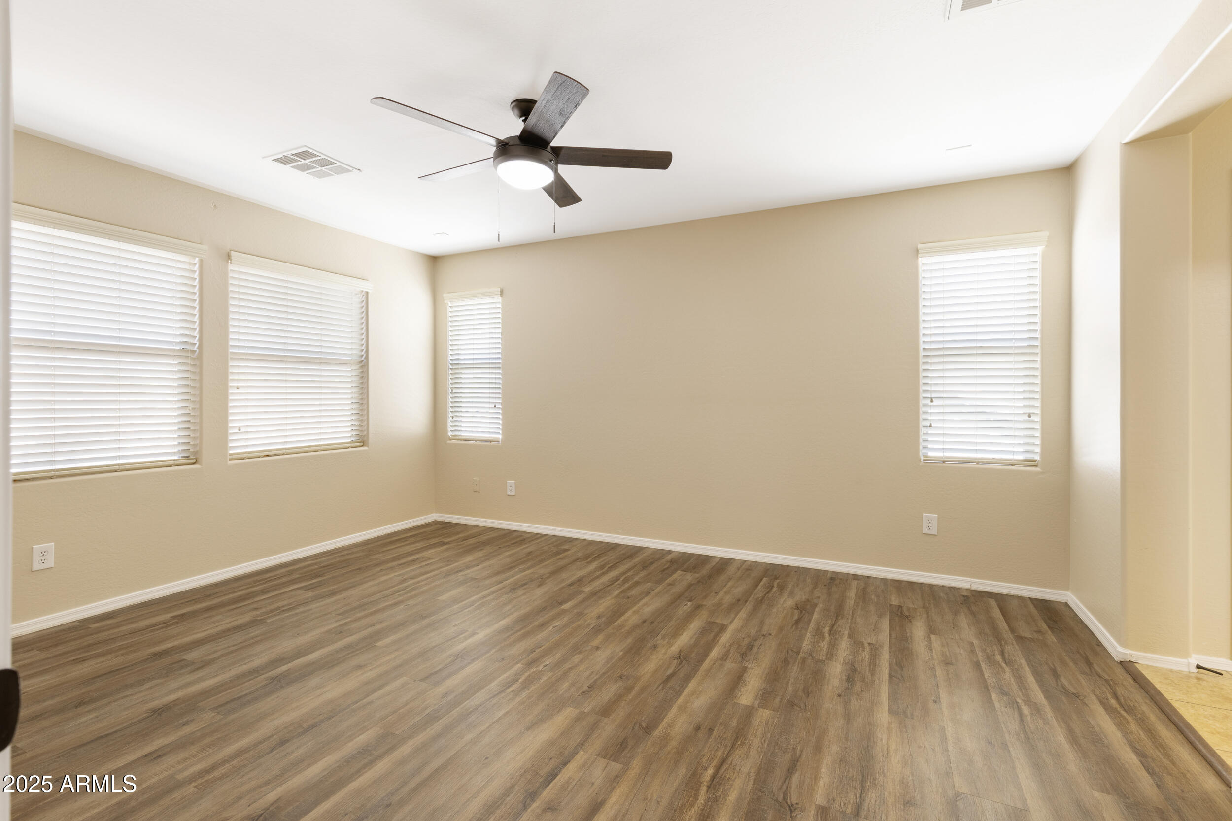 1870 South Colt Drive Gilbert, AZ 85295 - Photo 35 of 42 wooden floor in an empty room with a window