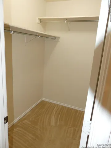 a view of a bathroom from a hallway