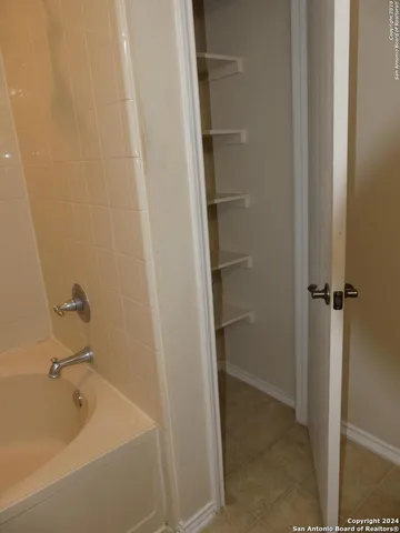 a view of an empty room with a closet