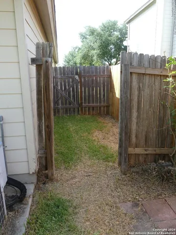 a kitchen with stainless steel appliances granite countertop a sink and a stove