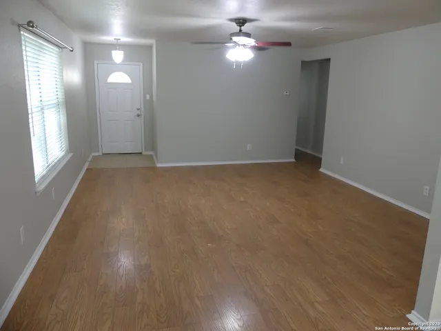 a kitchen with stainless steel appliances granite countertop a refrigerator and a stove