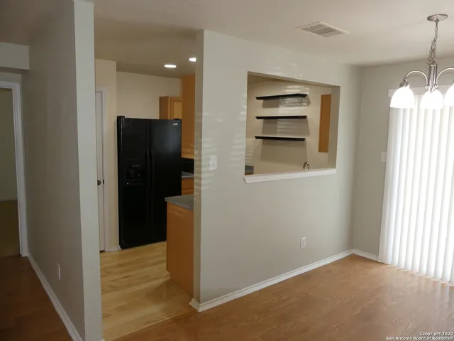 a living room with couches and painted walls