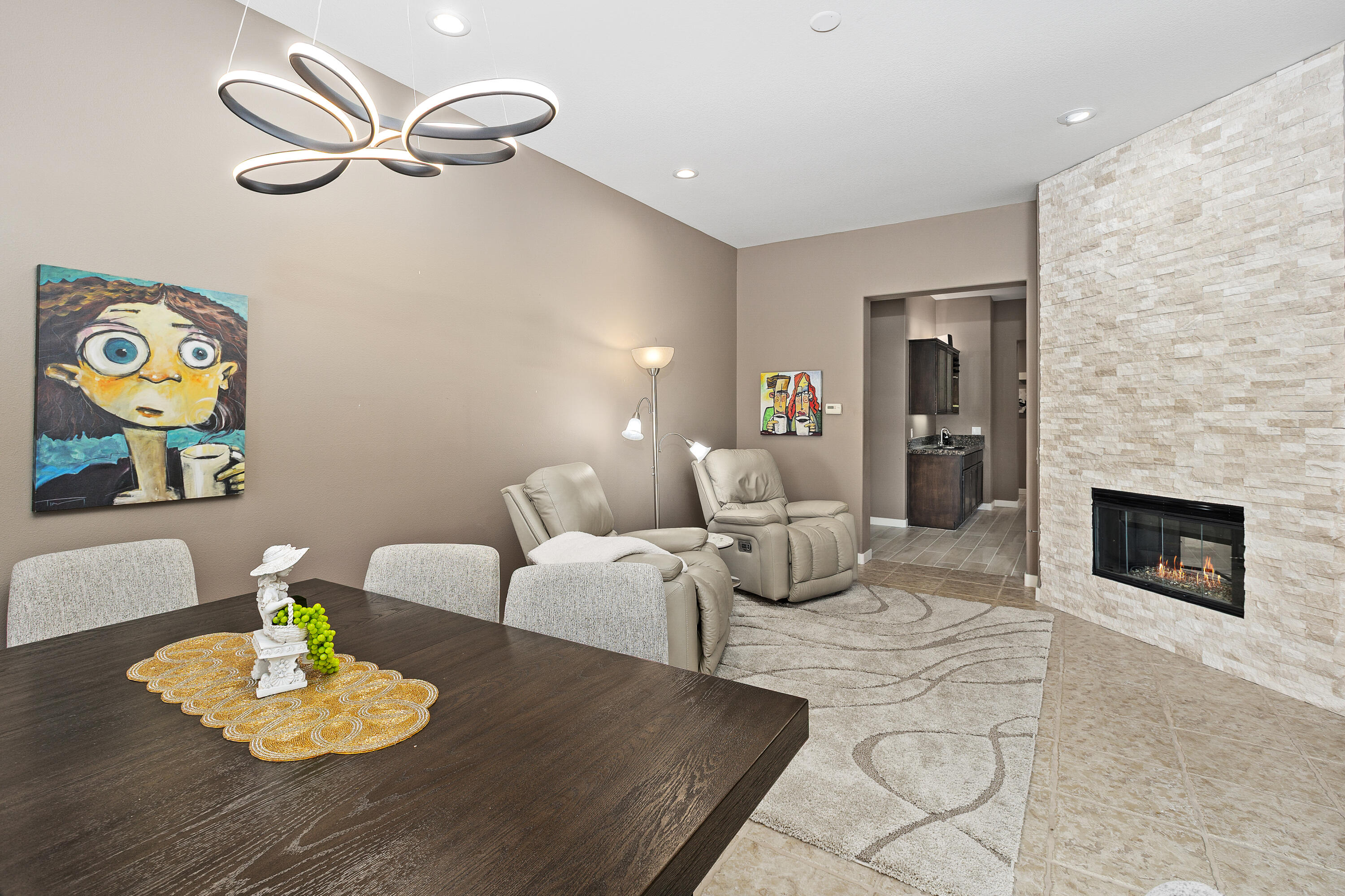 89 North Kavenish Drive Rancho Mirage, CA 92270 - Photo 15 of 40 a living room with furniture and a fireplace