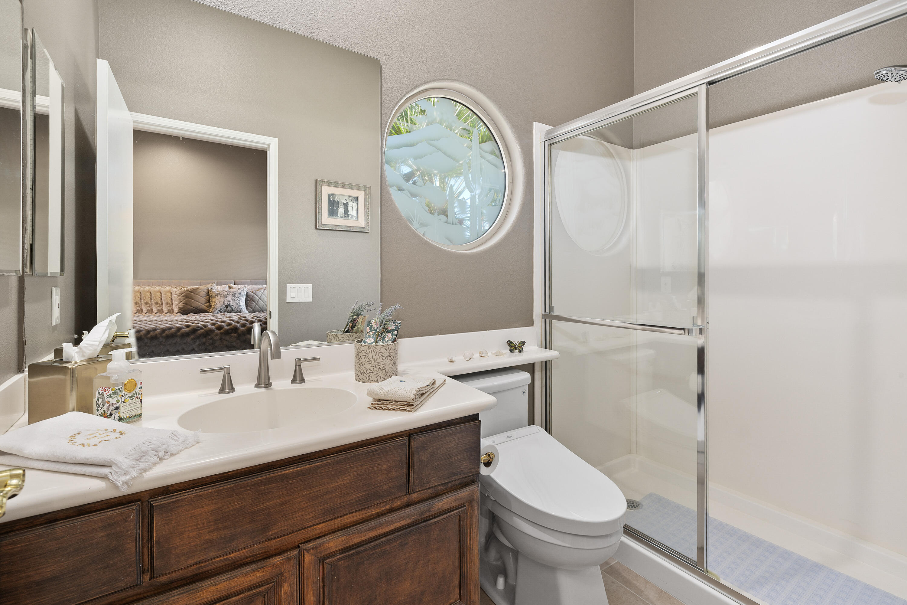 89 North Kavenish Drive Rancho Mirage, CA 92270 - Photo 28 of 40 a bathroom with a sink a toilet and a mirror