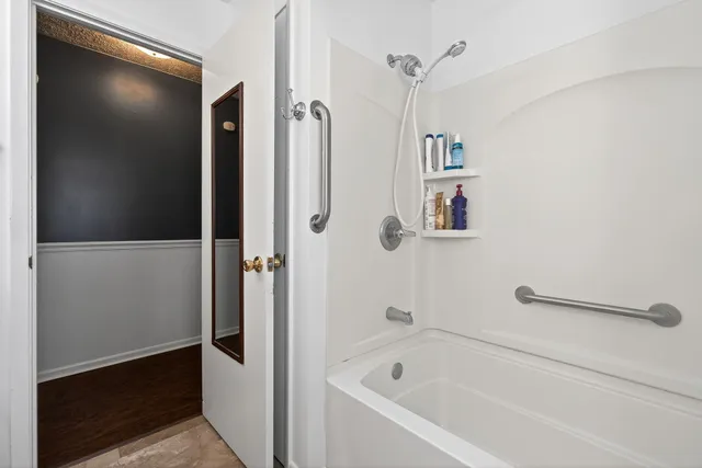 a bathroom with a bathtub and a shower