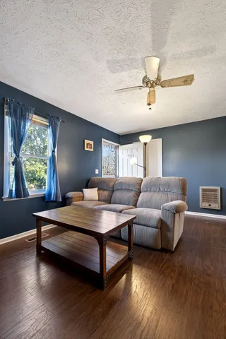 a living room with furniture and a large window