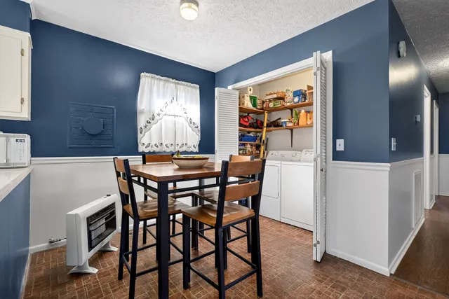 a view of a dining room with furniture