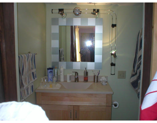 7 Liberty Road Bolton, MA 01740 - Photo 8 of 13 a bathroom with a sink vanity and a mirror