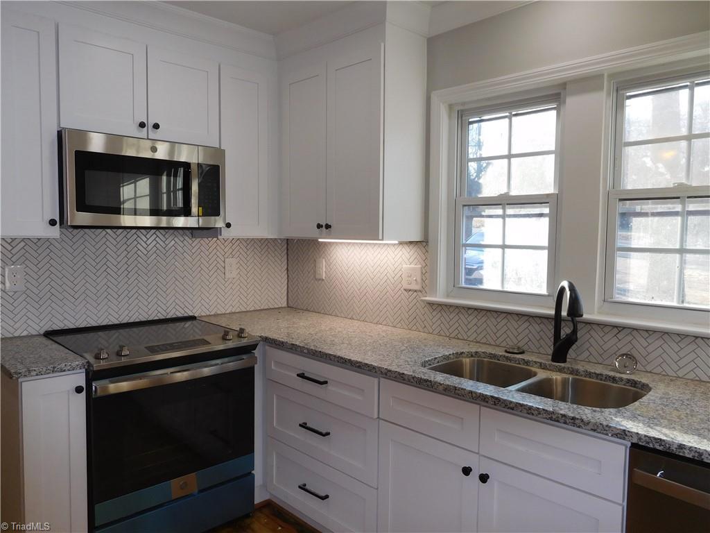 505 Motor Road Winston-Salem, NC 27105 - Photo 11 of 29 All New Eat-in Kitchen. Shaker Style Cabinets, Tile Backsplash, under Cabinet Lights, SS Appliances.
